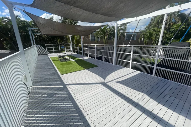Slide: The Image of Modern Struktures MS400 deck with shade sails and green turf, 2023 model. - 12