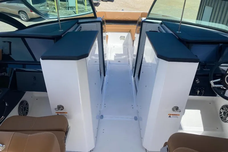 Slide: The Image of 2026 Four Winns H33 boat interior with modern helm and seating. - 19