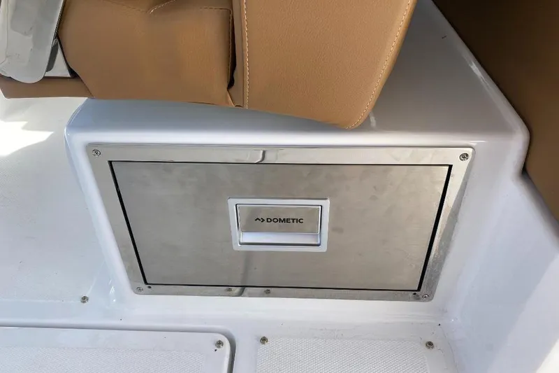 Slide: The Image of Built-in Dometic cooler on 2026 Four Winns H33 boat, featuring sleek stainless steel design. - 23