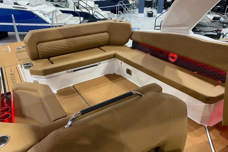 Slide: The Image of 2026 Four Winns H33 boat interior with tan seating and modern design. - 29