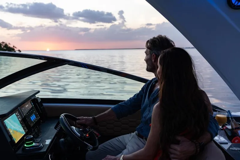 Slide: The Image of 2026 Four Winns H33 helm with dual Garmin displays and modern controls. - 8