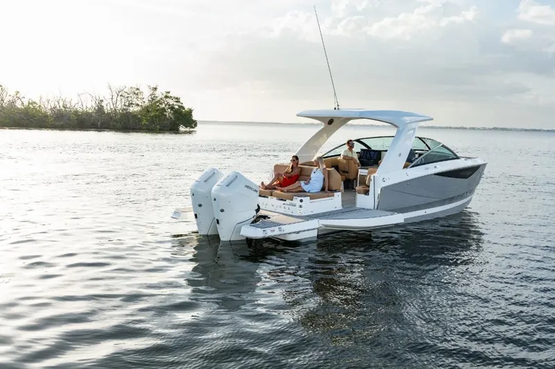 Slide: The Image of 2026 Four Winns H33 boat interior with modern dashboard and seating area. - 9