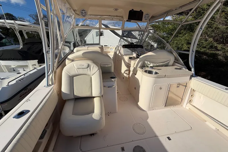 Slide: The Image of 2009 Grady-White Tournament 307 boat interior with seating and helm station. - 17