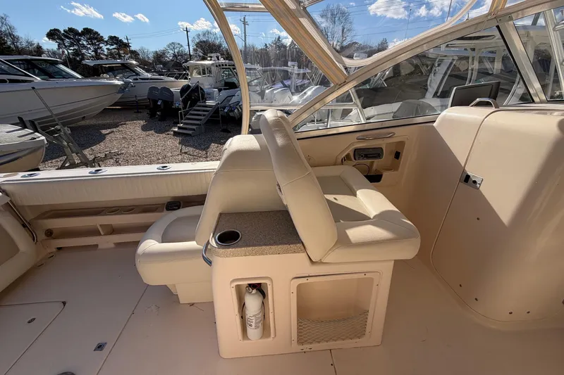 Slide: The Image of 2009 Grady-White Tournament 307 boat interior with seating and storage. - 22
