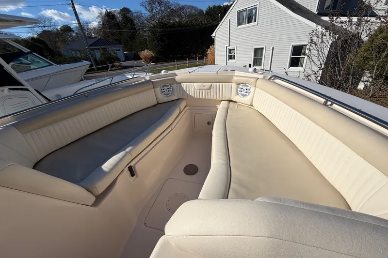 Slide: The Image of 2009 Grady-White Tournament 307 boat interior with beige seating and speakers. - 33