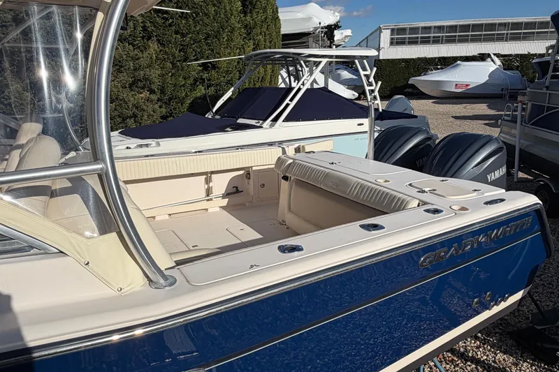 Slide: The Image of 2009 Grady-White Tournament 307 boat with Yamaha engines, parked outdoors. - 8