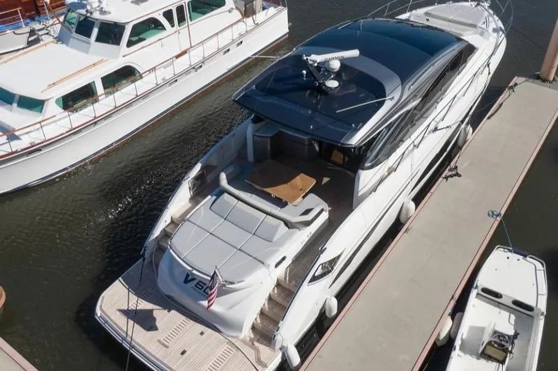 Slide: The Image of 2019 Princess V60 yacht docked at marina, aerial view. - 4