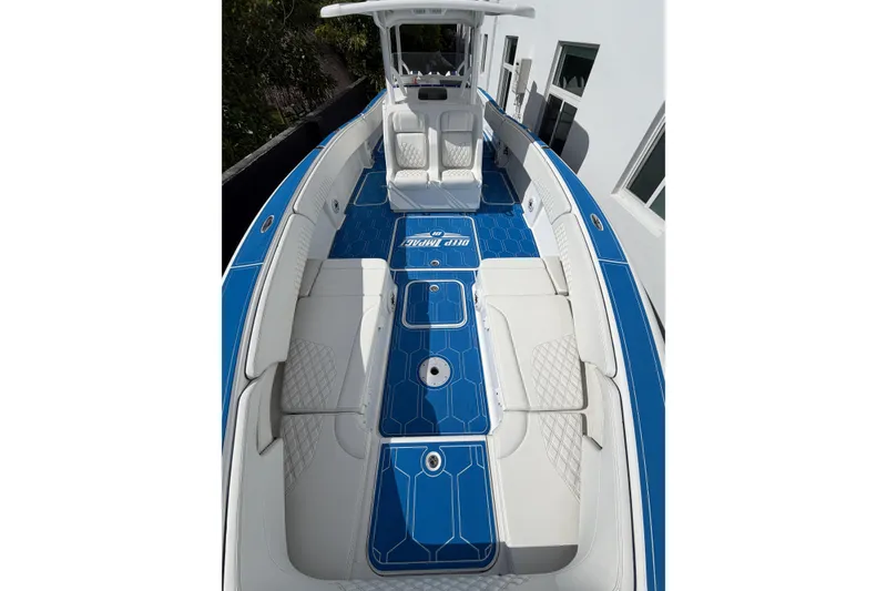 Slide: The Image of 2012 Deep Impact 399 Sport boat with blue and white interior design. - 12