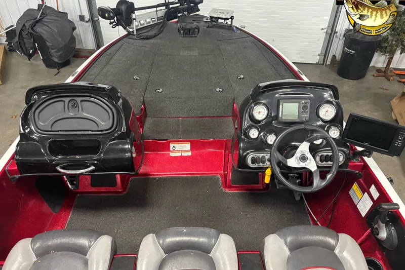 Slide: The Image of 2014 Nitro Z-7 boat interior with steering wheel, dashboard, and seating. - 4