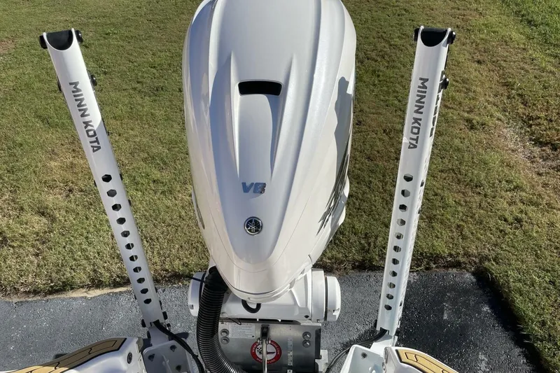 Slide: The Image of 2023 Sportsman Masters 267 Bay Boat with Minn Kota poles and V8 engine. - 11