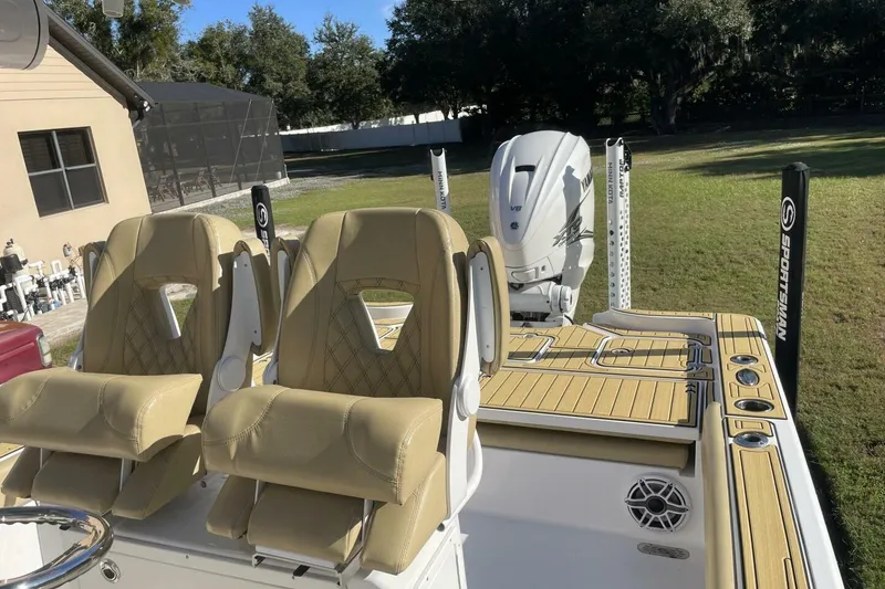 Slide: The Image of 2023 Sportsman Masters 267 Bay Boat with tan seats and Yamaha V8 engine. - 28