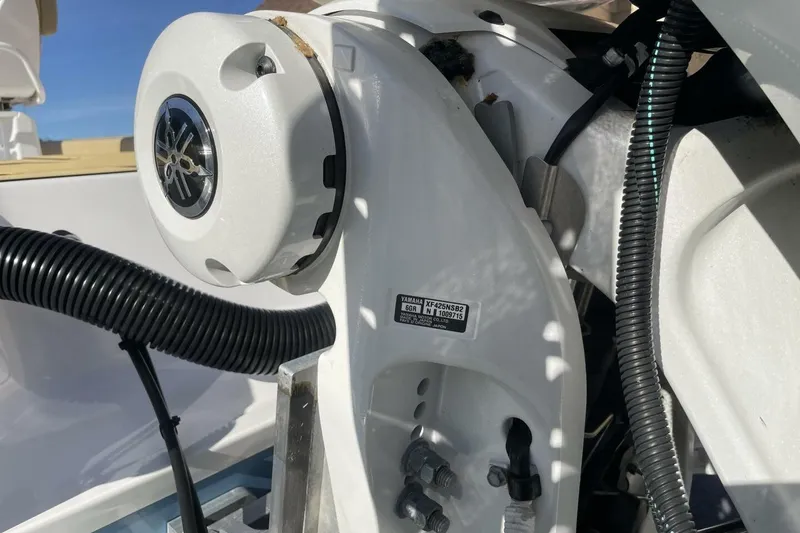 Slide: The Image of Close-up of 2023 Sportsman Masters 267 Bay Boat engine components. - 19