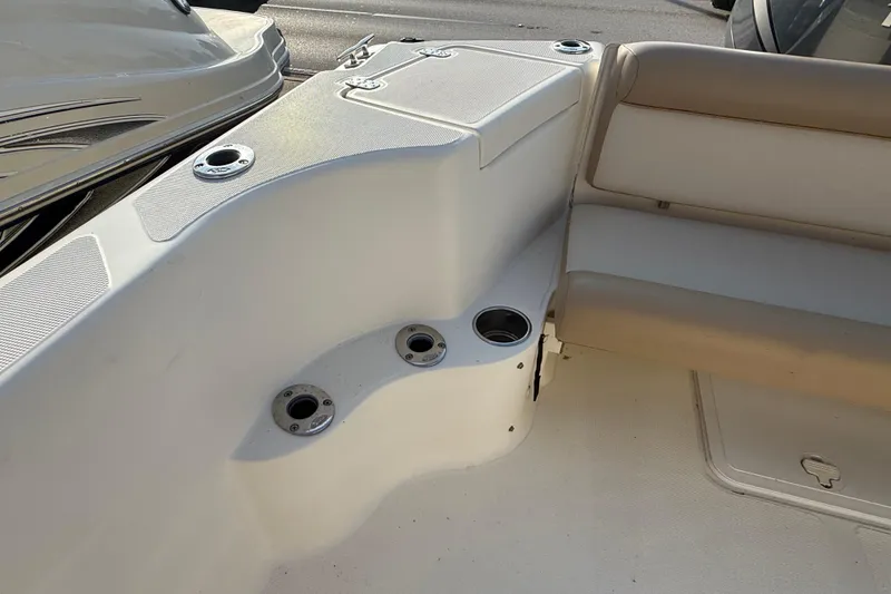 Slide: The Image of 2008 Scout 205 Sportfish boat interior with seating and cup holders. - 10