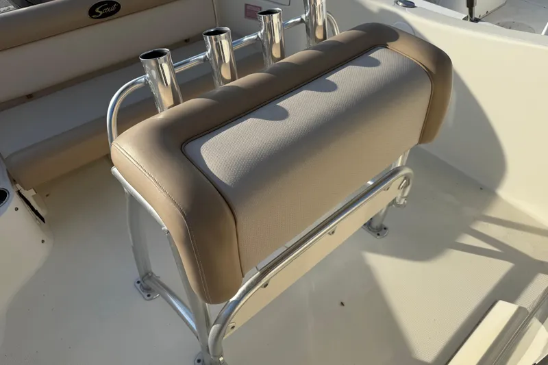 Slide: The Image of 2008 Scout 205 Sportfish boat seat with rod holders, beige upholstery. - 15