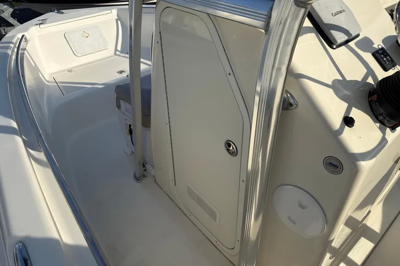 Slide: The Image of 2008 Scout 205 Sportfish boat interior with console and seating area. - 23