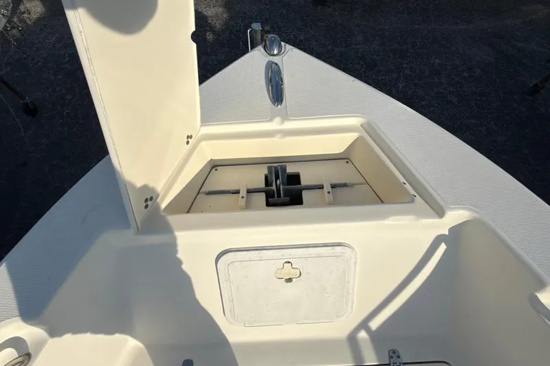 Slide: The Image of 2008 Scout 205 Sportfish boat anchor storage compartment open on deck. - 30