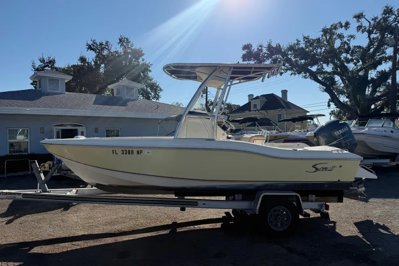 Slide: The Image of 2008 Scout 205 Sportfish boat on trailer, parked outdoors near buildings. - 5