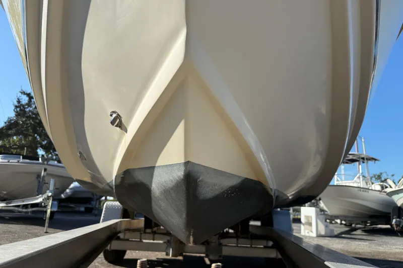 Slide: The Image of 2008 Scout 205 Sportfish boat on trailer, close-up of hull design. - 6