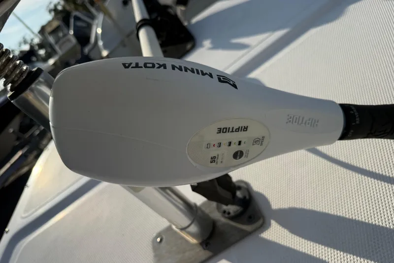 Slide: The Image of Minn Kota Riptide motor on 2018 Sundance K16CC boat deck. - 18