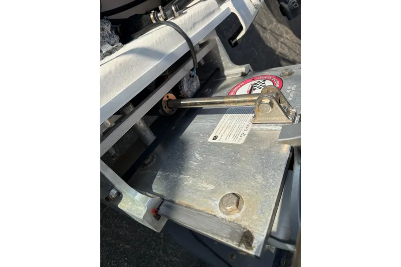 Slide: The Image of 2018 Sundance K16CC boat component with metal bracket and wiring detail. - 8