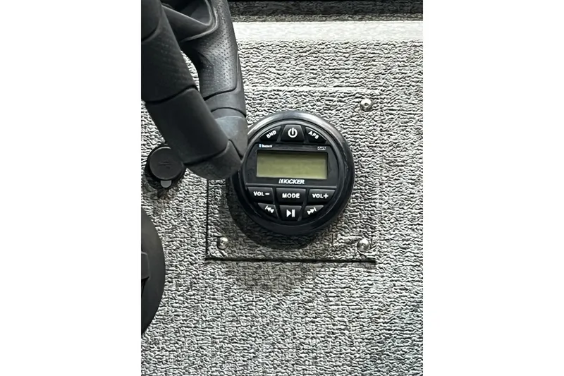 Slide: The Image of Dashboard of 2021 Lund 1875 Renegade boat with Kicker audio system controls. - 10