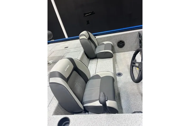 Slide: The Image of 2021 Lund 1875 Renegade boat interior with gray and black seating. - 6