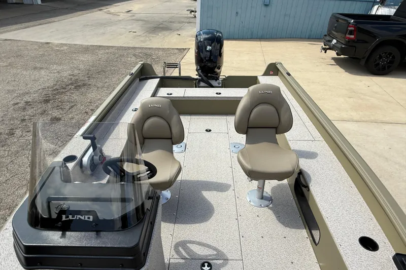 Slide: The Image of 2025 Lund 1875 Alaskan SS boat interior with two seats and steering console. - 15