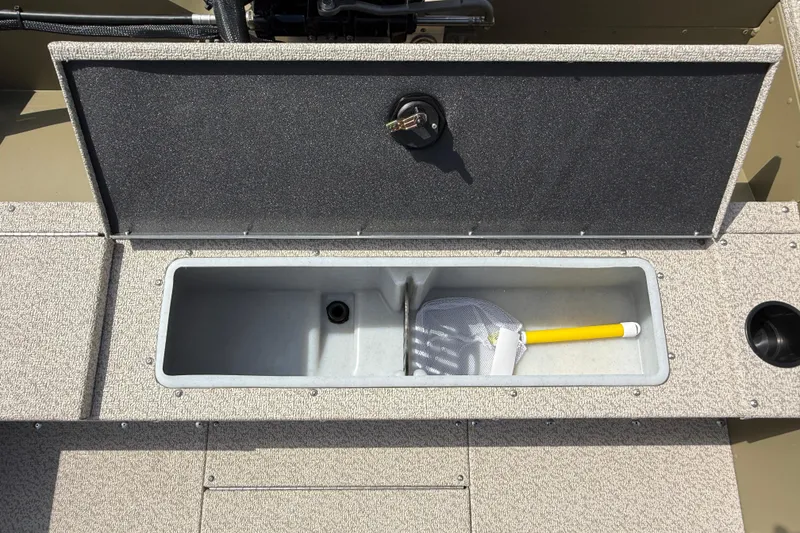 Slide: The Image of Open storage compartment on 2025 Lund 1875 Alaskan SS boat with a net inside. - 26