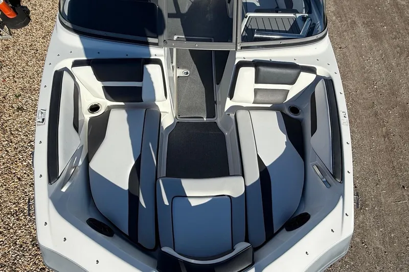 Slide: The Image of 2019 Yamaha AR195 boat interior with cushioned seating and cup holders. - 14