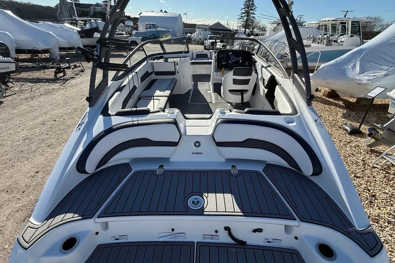 Slide: The Image of 2019 Yamaha Boats AR195 interior view, showcasing seating and steering area. - 6