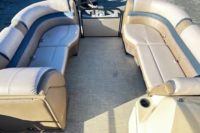 Slide: The Image of 2018 Godfrey Sweetwater 2286 SB Triple Tube pontoon boat with spacious seating and beige upholstery. - 11