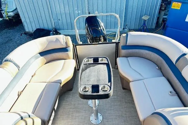 Slide: The Image of 2018 Godfrey Sweetwater 2286 SB Triple Tube pontoon boat interior with seating and table. - 12