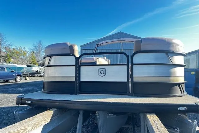 Slide: The Image of 2018 Godfrey Sweetwater 2286 SB Triple Tube pontoon boat on trailer, outdoor storage. - 2