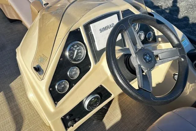 Slide: The Image of Steering console of 2018 Godfrey Sweetwater 2286 SB Triple Tube with Simrad display. - 6