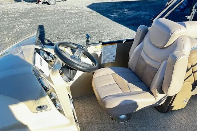 Slide: The Image of Captain's seat and steering wheel of 2018 Godfrey Sweetwater 2286 SB Triple Tube boat. - 7