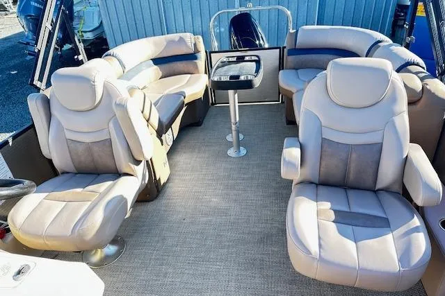Slide: The Image of 2018 Godfrey Sweetwater 2286 SB Triple Tube boat interior with plush seating and table. - 8
