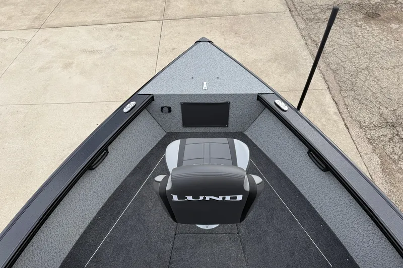 Slide: The Image of 2026 Lund 2075 Fisherman boat interior with seating and storage compartments. - 10