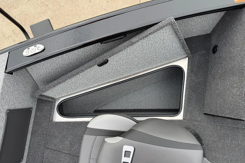 Slide: The Image of 2026 Lund 2075 Fisherman boat interior with storage compartment and seating. - 12