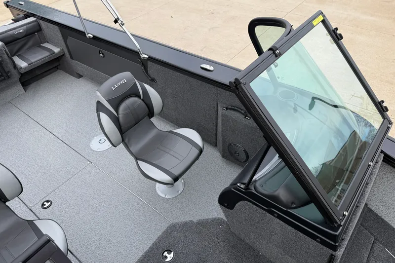 Slide: The Image of 2026 Lund 2075 Fisherman boat interior with seating and windshield. - 15