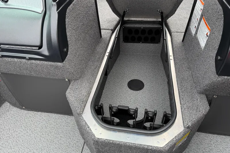 Slide: The Image of 2026 Lund 2075 Fisherman boat interior storage compartment with rod holders. - 16