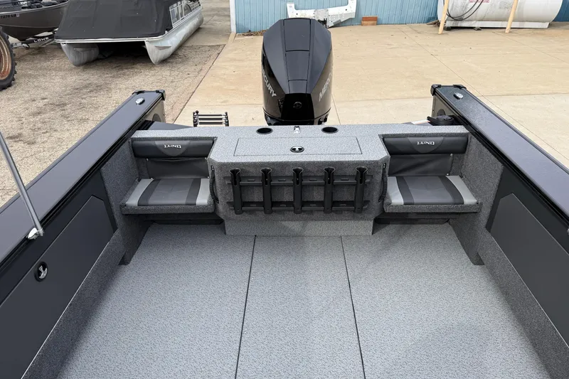Slide: The Image of 2026 Lund 2075 Fisherman boat interior with seating and rod holders. - 22