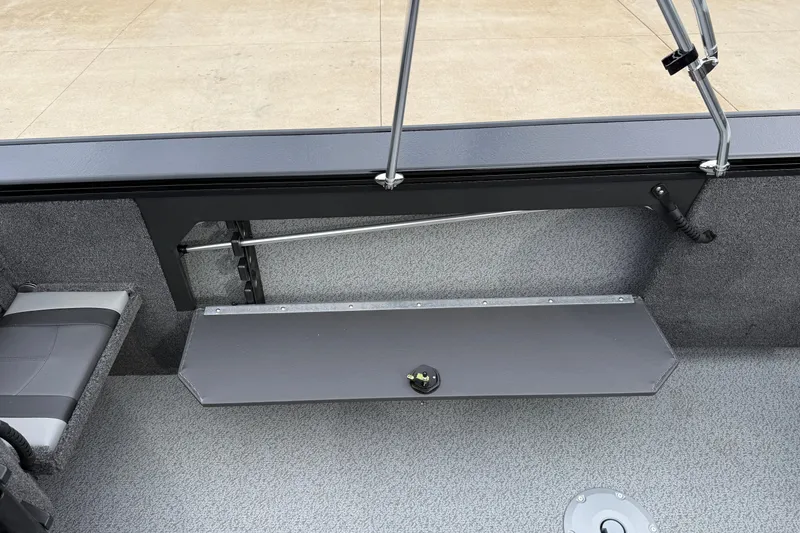 Slide: The Image of 2026 Lund 2075 Fisherman boat interior with storage compartment and seating. - 24