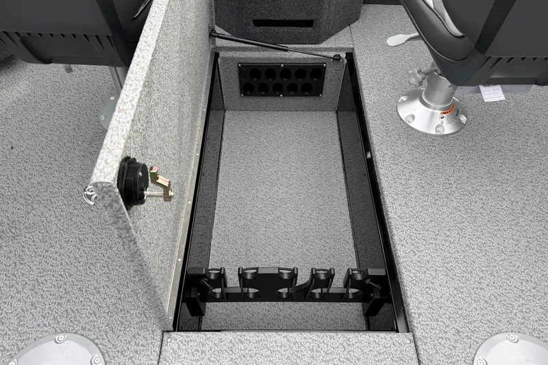 Slide: The Image of 2026 Lund 2075 Fisherman boat interior with open storage compartment and seating. - 26