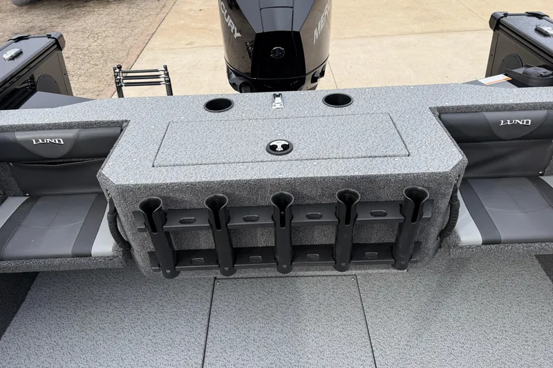 Slide: The Image of 2026 Lund 2075 Fisherman boat interior with rod holders and Mercury engine. - 29