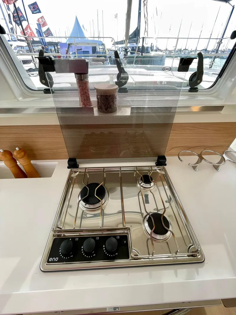 Slide: The Image of Modern kitchen stove on Bali 4.2 yacht, 2026 model, with three burners and control knobs. - 11
