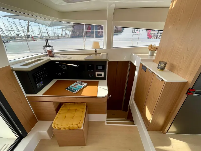 Slide: The Image of Modern interior of 2026 Bali 4.2 yacht with navigation station and seating area. - 12