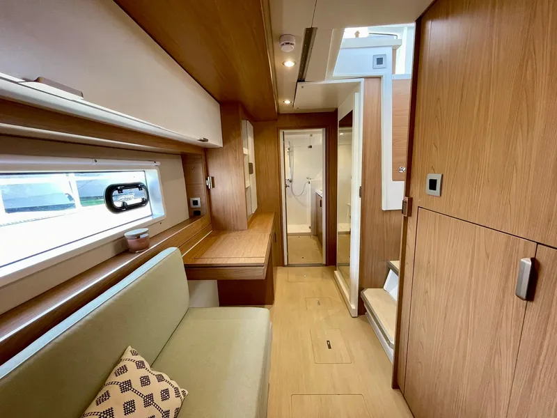Slide: The Image of Modern interior of 2026 Bali 4.2 yacht with wood finish and cozy seating area. - 15