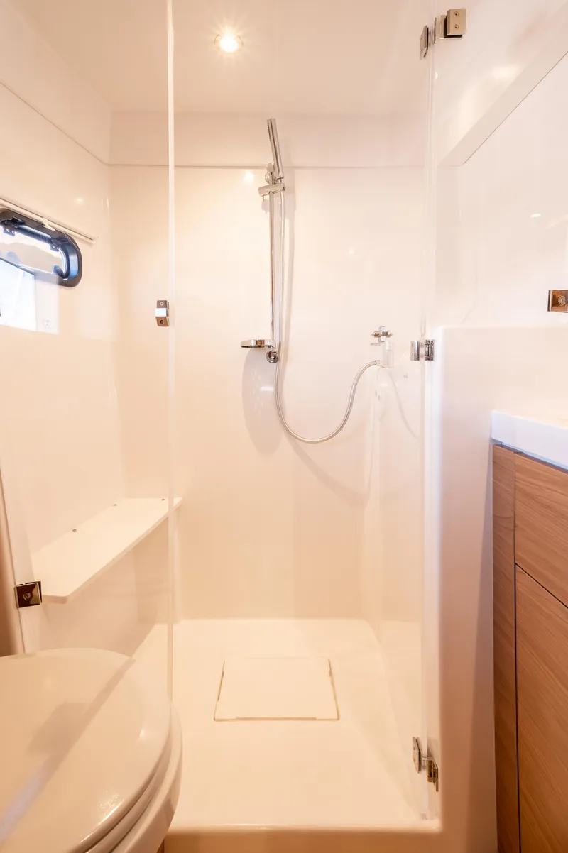 Slide: The Image of Modern bathroom in Bali 4.2 yacht, 2026 model, featuring sleek shower and wooden cabinetry. - 21