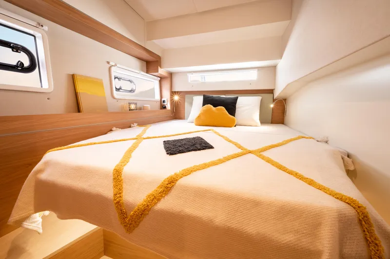 Slide: The Image of Cozy cabin interior of 2026 Bali 4.2 yacht with stylish bedding and modern design. - 22