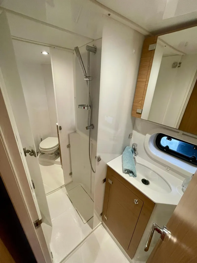Slide: The Image of Modern bathroom in a 2026 Bali 4.2 yacht, featuring sleek fixtures and compact design. - 26